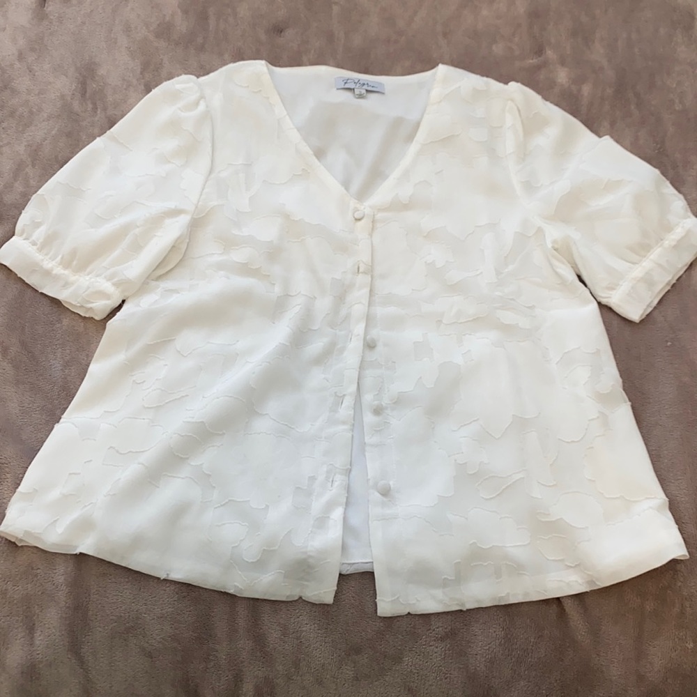 Floral embroidered white blouse.